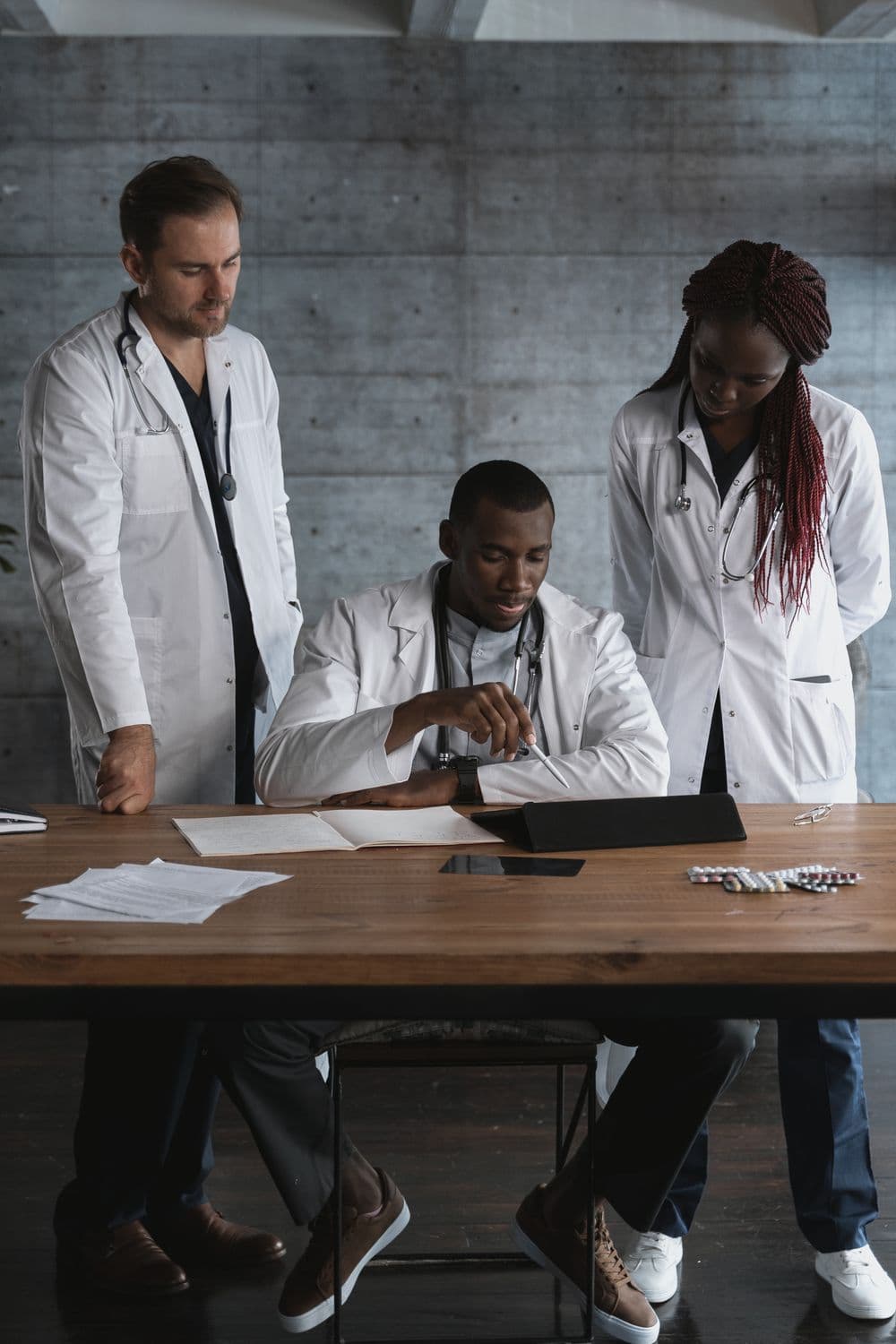 Clinicians reviewing findings together at a table.