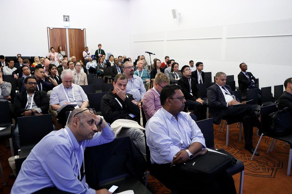 Delegates seated in a World Congress session, following a presentation.